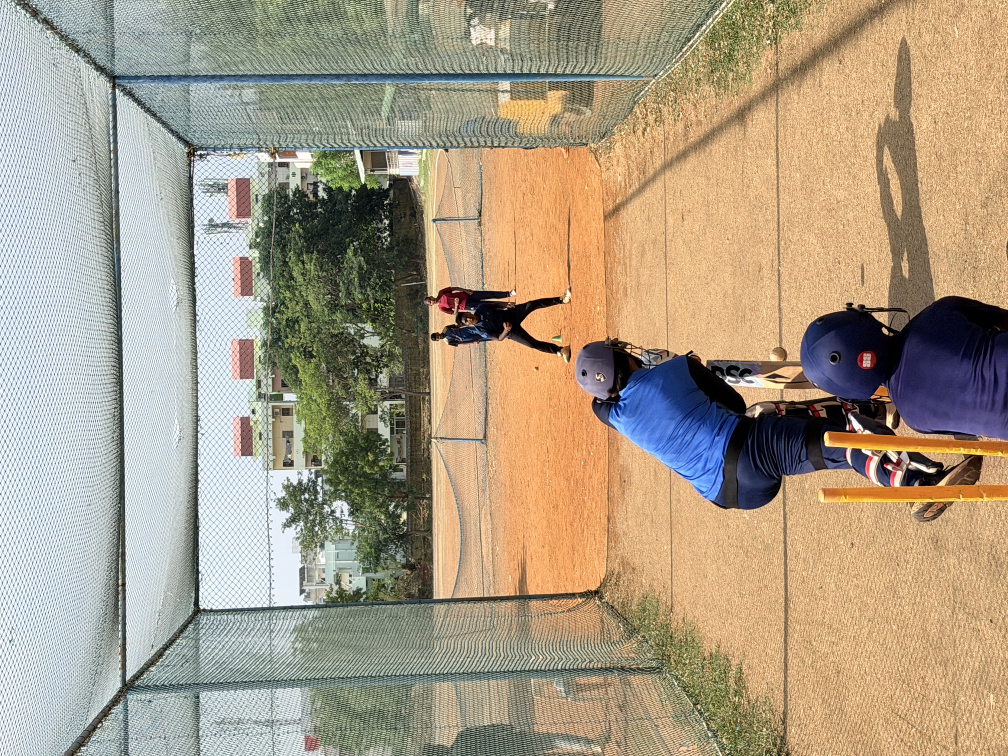 Young batters practising in the cricket nets