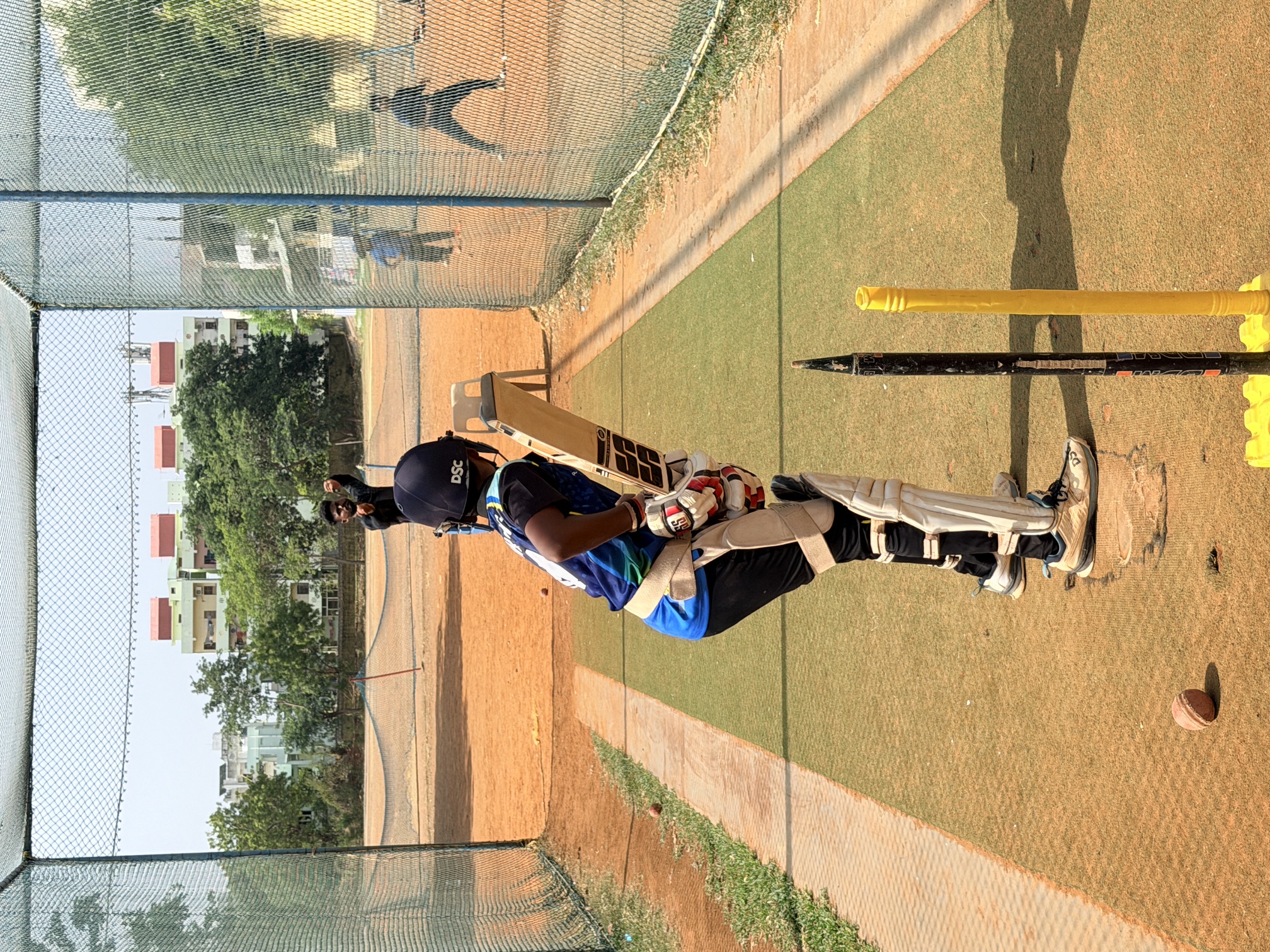 Young batter preparing for a delivery in the practice nets