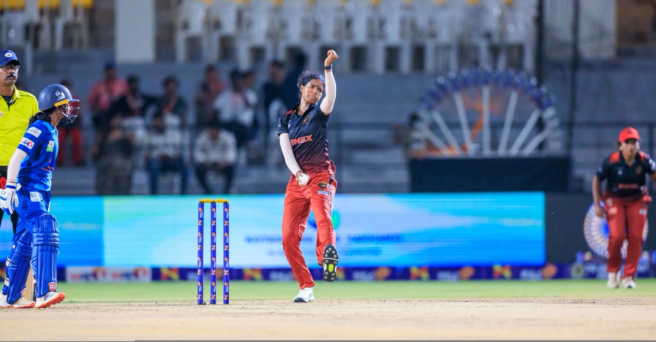 Bowler delivering the ball during a women's cricket match
